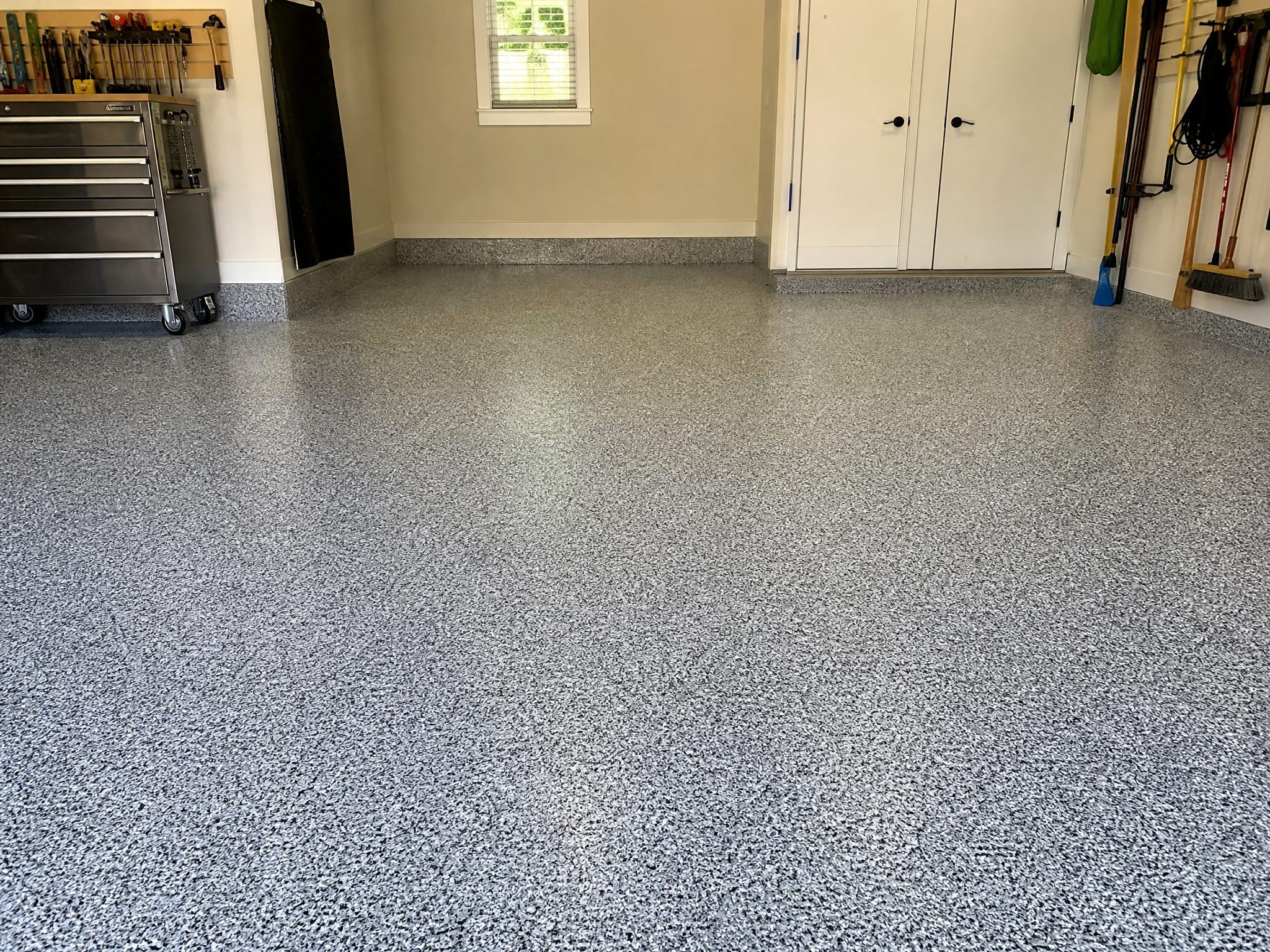 Completed flake (chip) garage floor coating showing professional quality workmanship in a American home