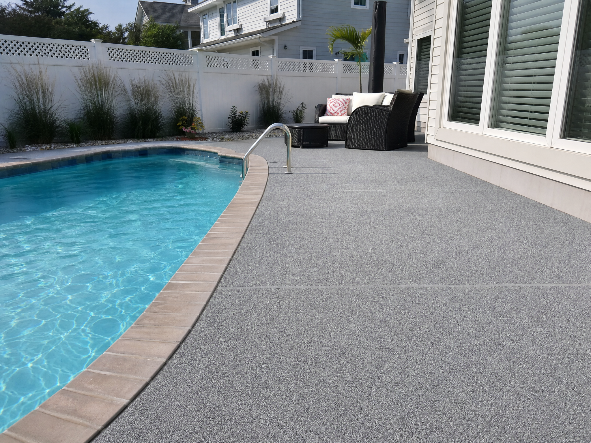 Completed pool deck coatings showing professional quality workmanship in a American home